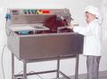 JKV30 chocolate tempering and moulding machine in use
