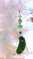 Christmas Pickle Ornament Hanging from Xmas Tree